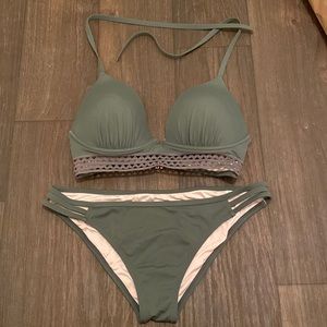 Adjustable halter bikini in olive with cutout rib band detail.